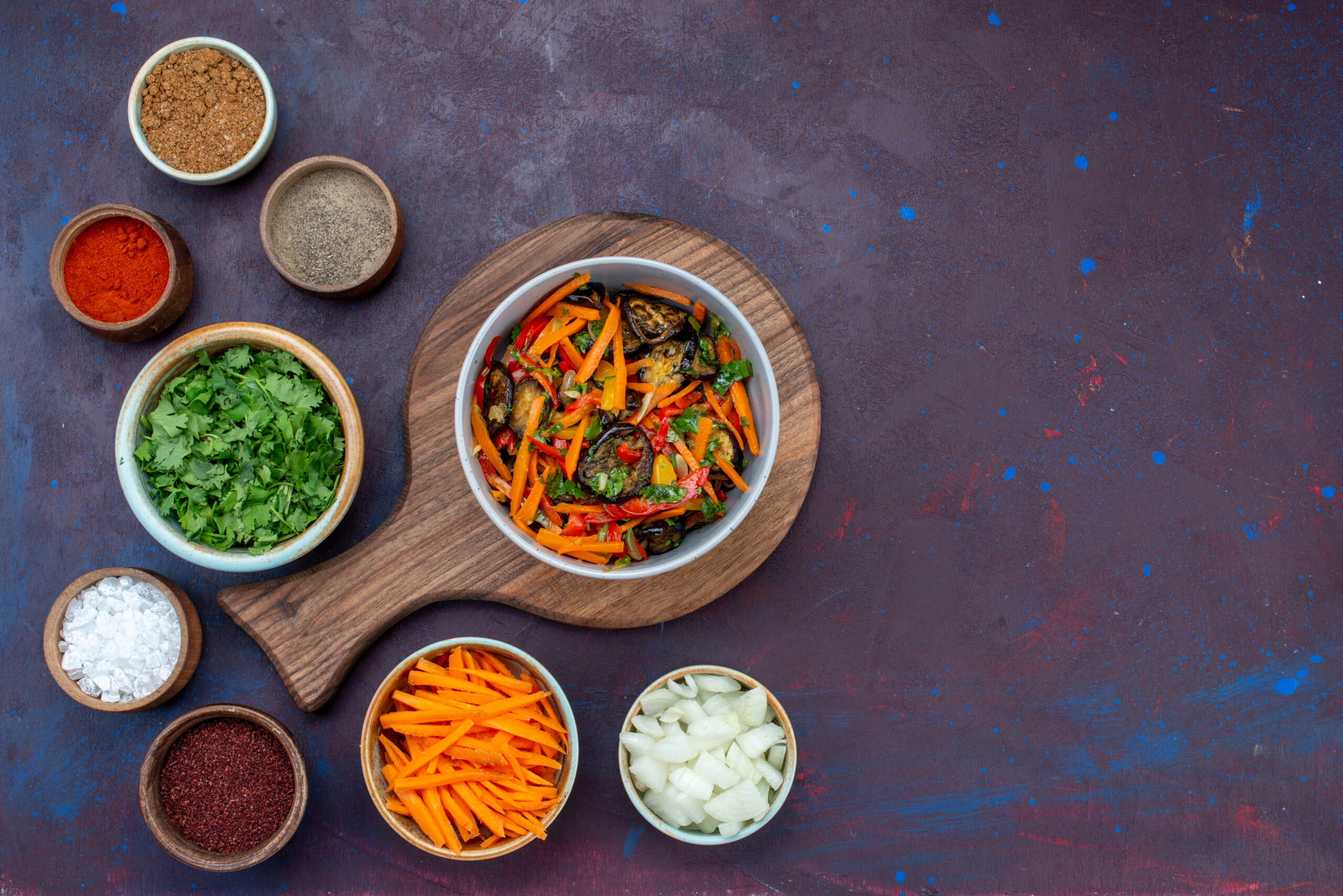 top-view-sliced-vegetable-salad-inside-plate-with-greens-seasonings-dark-desk